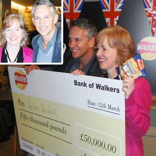 Helen being presented with her cheque by Gary Lineker