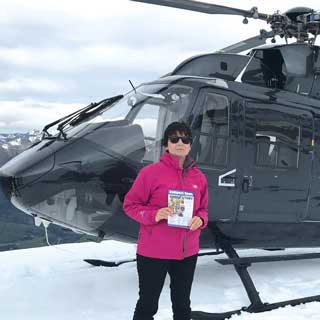 Susannah on top of a New Zealand mountain on her £25,000 holiday